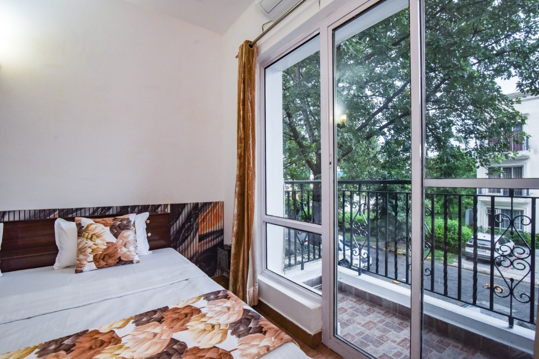 Bedroom with balcony view